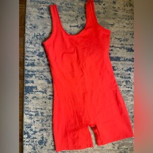 Girlfriend Collective Bike Unitard in Coral Orange